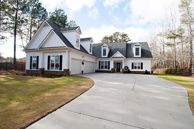 Large traditional white one-story wood exterior home idea in Atlanta with a shingle roof