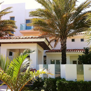 Mediterranean three-story exterior home idea in Miami