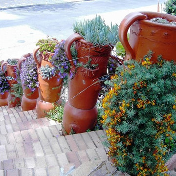 Front Yard with Artistic Driveway, Custom Sculptures, Planted Walls