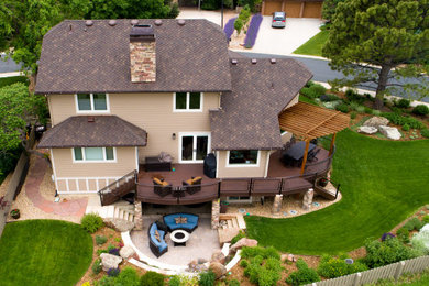 Large traditional beige three-story concrete fiberboard house exterior idea in Denver with a shingle roof