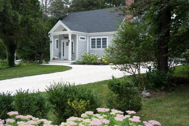 Transitional gray house exterior idea in Boston with a shingle roof