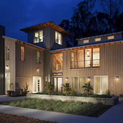 Example of a farmhouse wood exterior home design in San Luis Obispo