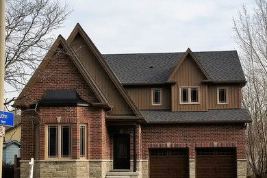 Example of a classic two-story exterior home design in Toronto