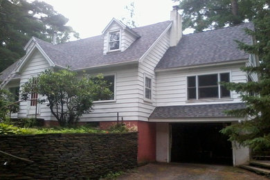 Example of a white two-story exterior home design in Boston