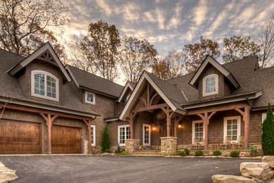 Example of a large arts and crafts brown one-story wood exterior home design in Charlotte