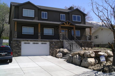 Large gray three-story stucco exterior home photo in Salt Lake City