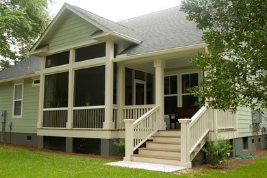 Inspiration for a mid-sized green one-story vinyl gable roof remodel in Charleston
