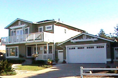 Inspiration for a mid-sized beige two-story mixed siding exterior home remodel in San Diego