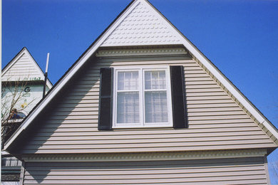 Example of a large transitional two-story gable roof design in Kansas City