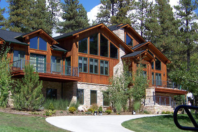 Example of a large brown two-story mixed siding exterior home design in Albuquerque