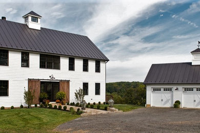 Inspiration for a farmhouse exterior home remodel in DC Metro