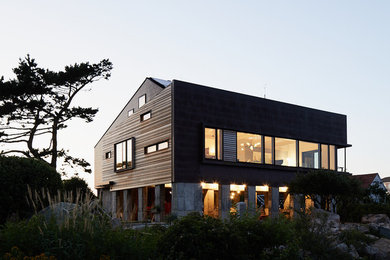Example of a beach style metal house exterior design in Boston