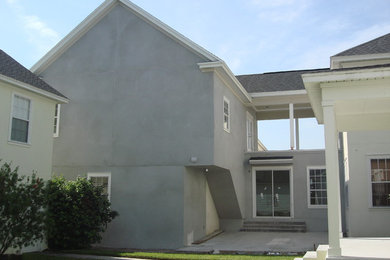 Huge elegant gray two-story apartment exterior photo in Tampa