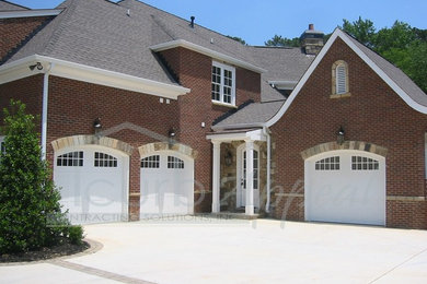Large elegant two-story brick exterior home photo in Atlanta