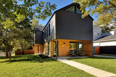 Inspiration for a contemporary gray two-story mixed siding exterior home remodel in Austin with a shingle roof