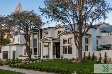 Example of a large transitional white two-story wood exterior home design in Los Angeles with a shingle roof