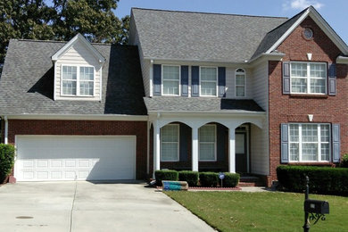 Example of a large classic multicolored two-story mixed siding exterior home design in Atlanta with a shingle roof
