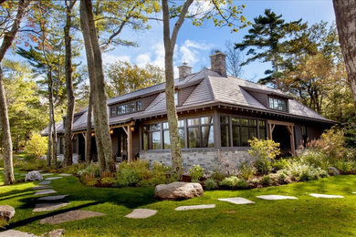 Example of a large trendy brown one-story mixed siding exterior home design in Toronto with a tile roof