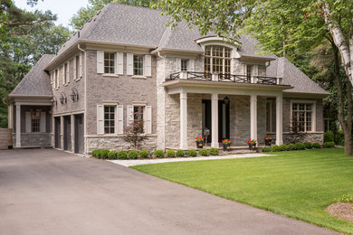 Traditional exterior home idea in Toronto with a hip roof