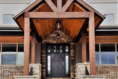 Example of a large mountain style two-story wood exterior home design in Denver