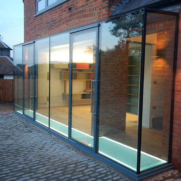 Glazing opening to cobblestone courtyard