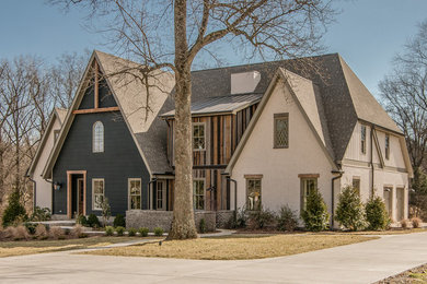 Example of a transitional wood exterior home design in Nashville