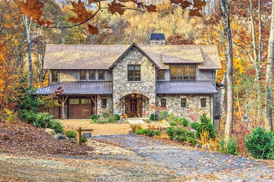 Example of a mountain style two-story mixed siding exterior home design in Other