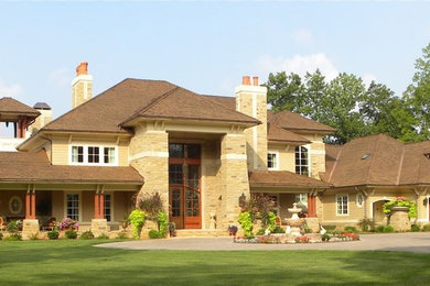 Example of a tuscan beige three-story concrete fiberboard exterior home design in Charlotte