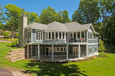 Large transitional gray two-story wood exterior home idea in Other with a shingle roof