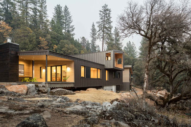Inspiration for a mid-sized modern multicolored two-story metal house exterior remodel in Sacramento with a metal roof