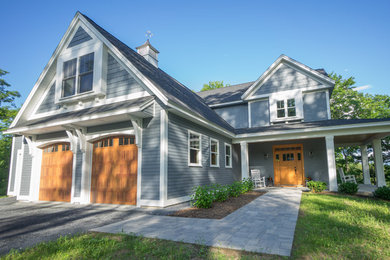 Large craftsman gray three-story exterior home idea in Burlington
