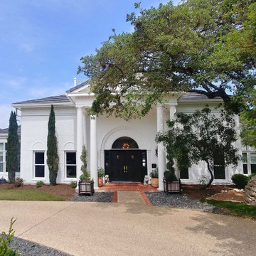 Grand Home with White Painted Brick Exterior