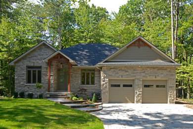 Transitional gray two-story stone exterior home idea