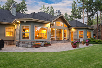 Mid-sized transitional brown two-story wood exterior home photo in Salt Lake City with a shingle roof