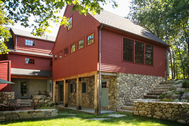 Mid-sized country red two-story mixed siding gable roof idea in Boston