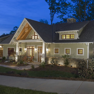 Example of an arts and crafts green exterior home design in Other