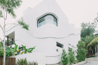 Example of a minimalist white exterior home design in Los Angeles