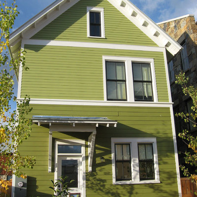 Example of an ornate wood exterior home design in Charlotte