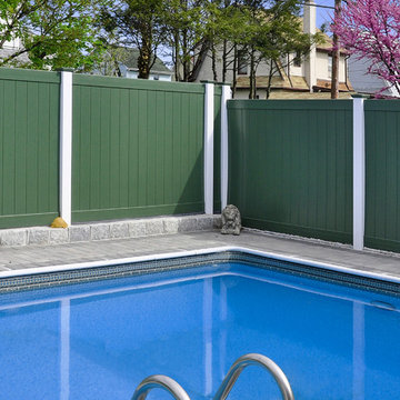 Green PVC Vinyl Privacy Fence with White Posts from Illusions Vinyl Fence