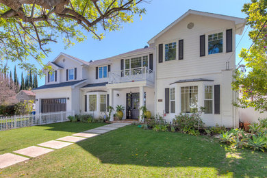 Large elegant white two-story mixed siding gable roof photo in Los Angeles