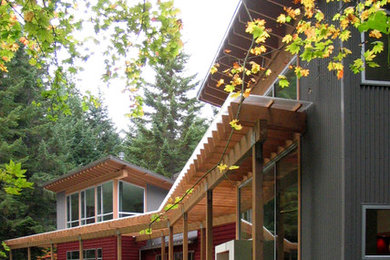 Modern two-story mixed siding exterior home idea in Seattle with a shed roof