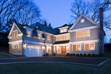 Example of a mid-sized arts and crafts gray two-story wood exterior home design in New York with a shingle roof