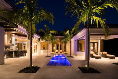 Inspiration for a large contemporary one-story house exterior remodel in Miami