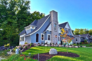 Example of a mid-sized transitional gray two-story wood gable roof design in Minneapolis