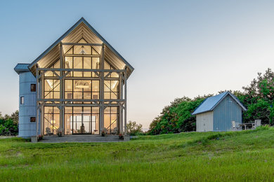 Inspiration for a large and white rural two floor detached house in Baltimore with wood cladding, a pitched roof and a metal roof.