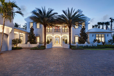 Inspiration for a large transitional white two-story exterior home remodel in Miami