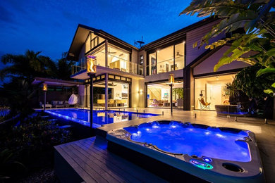 Design ideas for a world-inspired house exterior in Cairns.