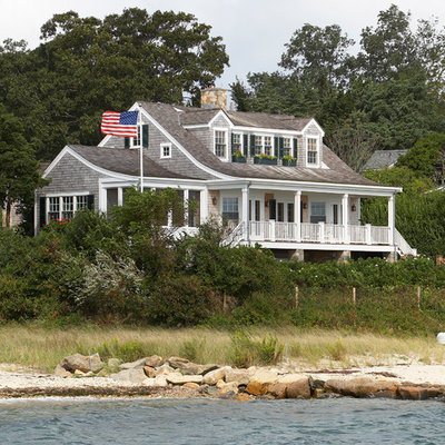 Inspiration for a mid-sized coastal gray two-story wood gable roof remodel in Boston