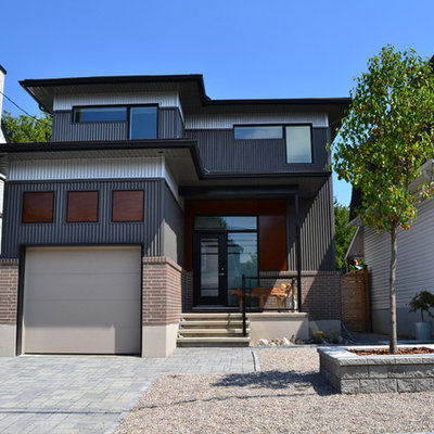 Mid-sized trendy gray two-story mixed siding exterior home photo in Ottawa with a hip roof