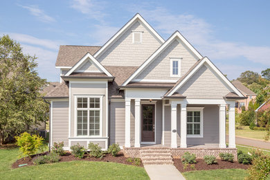 Mid-sized traditional gray two-story wood gable roof idea in Other
